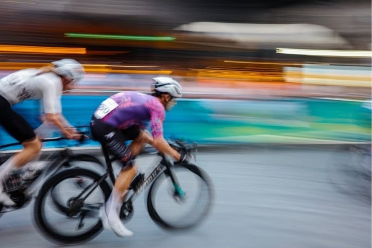 Close-up view of cyclist's legs pedalling on a road bike