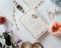 An elegant, modern wedding ring set resting on top of a signed marriage certificate, symbolizing a legal name change and a major shift in identity.