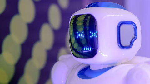 Close-up of a futuristic humanoid robot with a luminescent display.