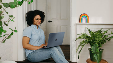 Person coding on a laptop at home.