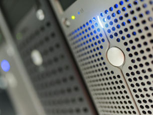 Focused detail of a modern server rack with blue LED indicators in a data center.