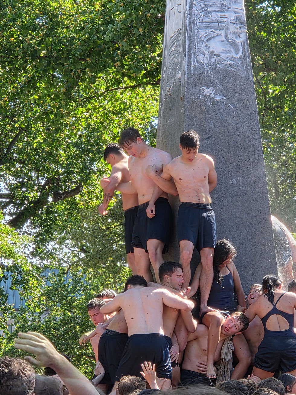 USNA Plebes climbing the Herndon monument