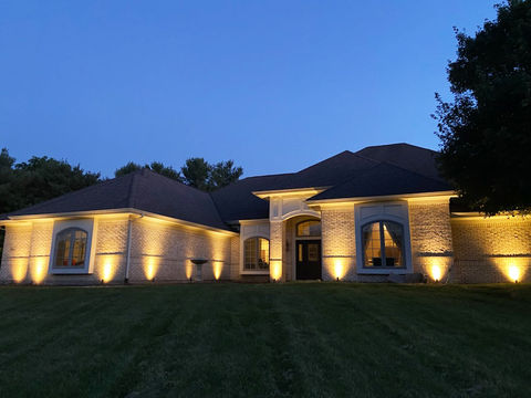 Exterior wall lighting shown at night