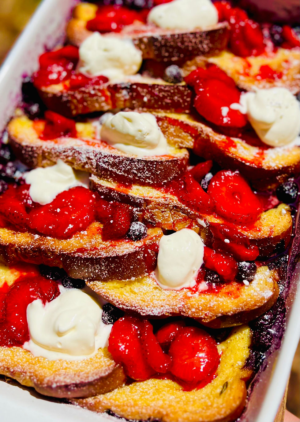 Eye-level view of a colorful Red White and Blueberry French Toast Casserole