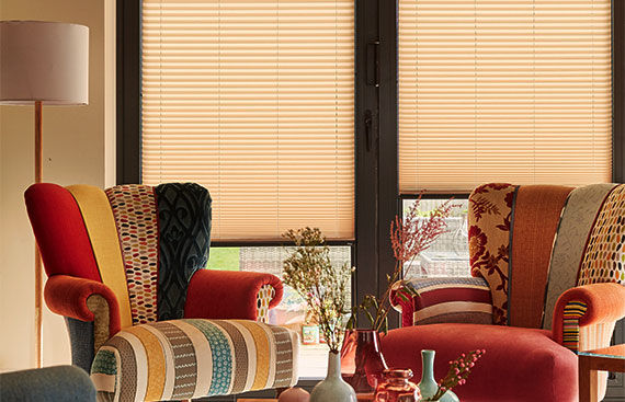 Eye-level view of honeycomb blinds covering a large window