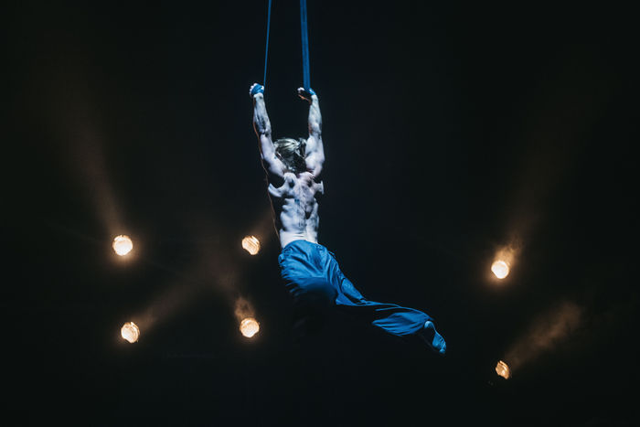 Eric Hardy performing on aerial straps at Synergy