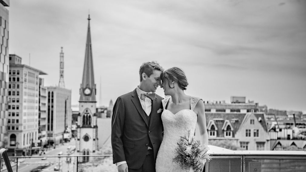 Black and white bride and groom on the rooftop of the Madison in downtown Detroit