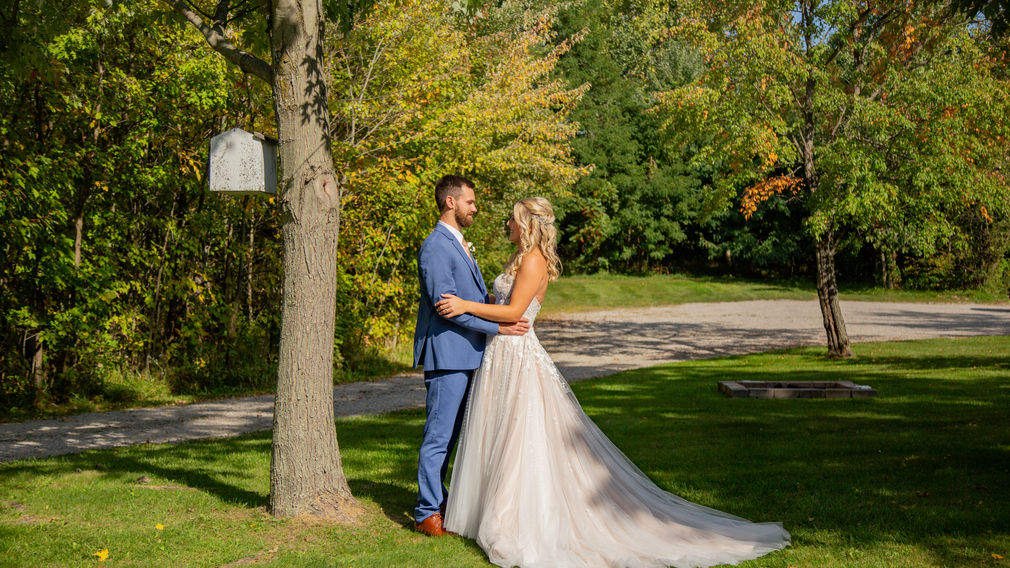 Bride and groom embrace at a special spot