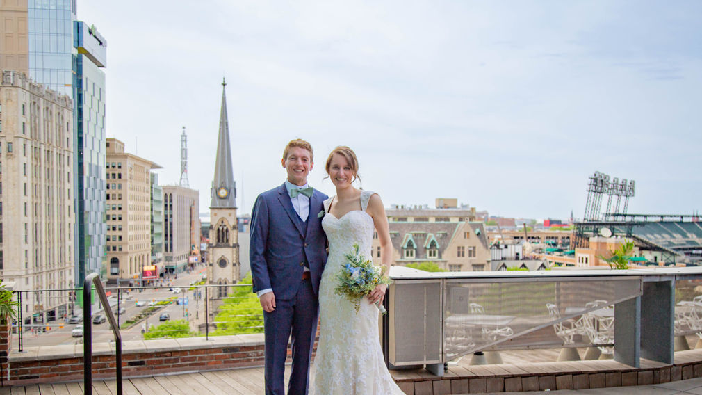 Bride and groom celebrate on the rooftop of the Madison in downtown Detroit