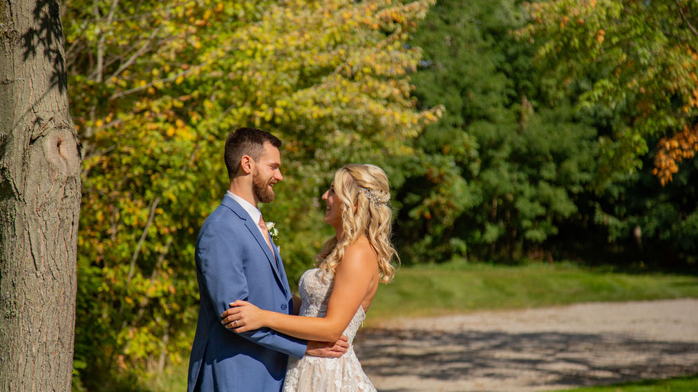 Bride and groom embrace at a special spot