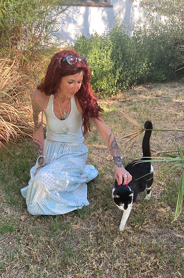 Claire petting her cat Aria