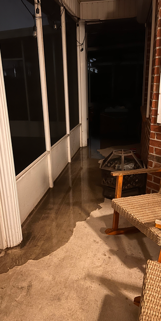 Flooing in patio area due to flooding in backyard