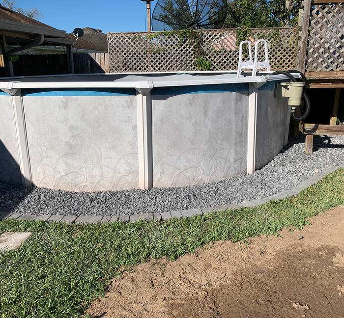 gravel and edging install around the backyard pool