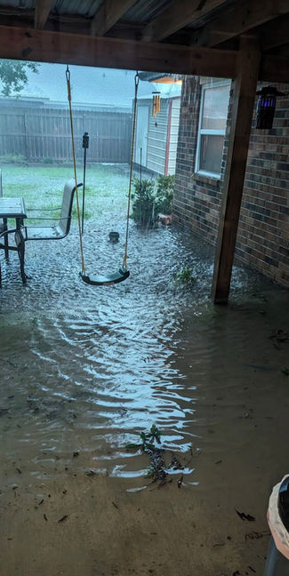 flooding in backyard patio and foundation of the home