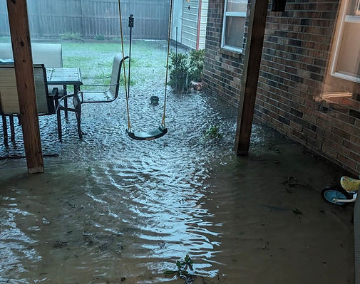 flooding in backyard patio and foundation of the home
