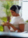Black woman typing or searching on her phone.