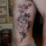 Jade Wildman tattoo bold blackwork traditional rose on ribs male