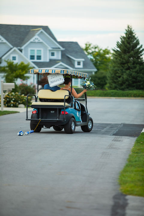 Bride and groom golf cart at Ohio island wedding