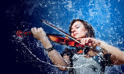 girl-playing-the-violin-in-the-rain