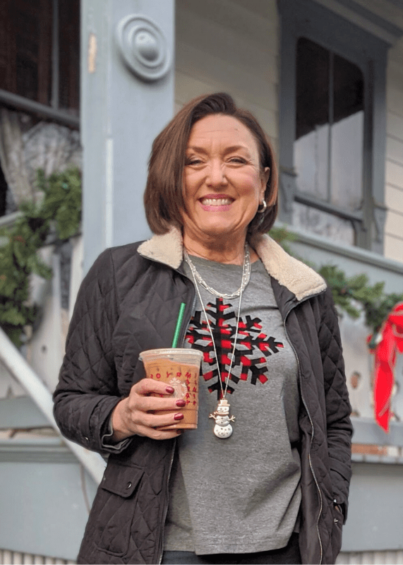 Snowflake tshirt with quilted black jacket outfit.