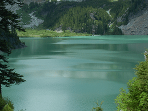 A green-blue lake in Washington, representing Washington State CPE requirements