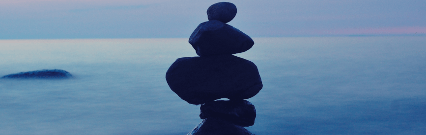 Rocks stacked on top of each other, representative of balancing work and school