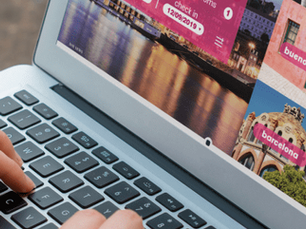 A person looking at a site on a laptop which used image optimization for its pictures