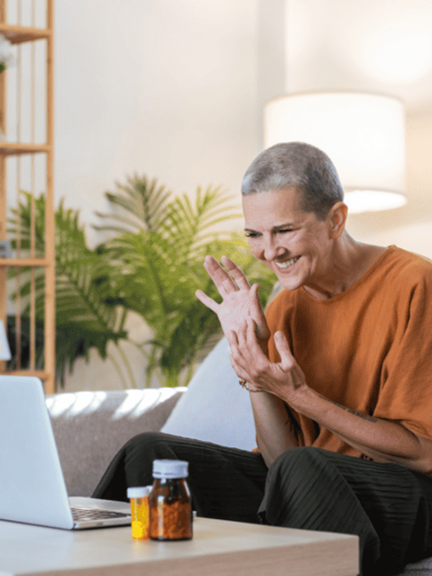 A patient logs into a virtual telehealth visit with their provider. They came prepared with their medications and prescriptions.