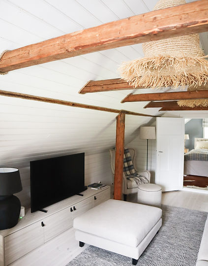 Villa Junnola living room with sofas and TV for a comfortable, relaxing space