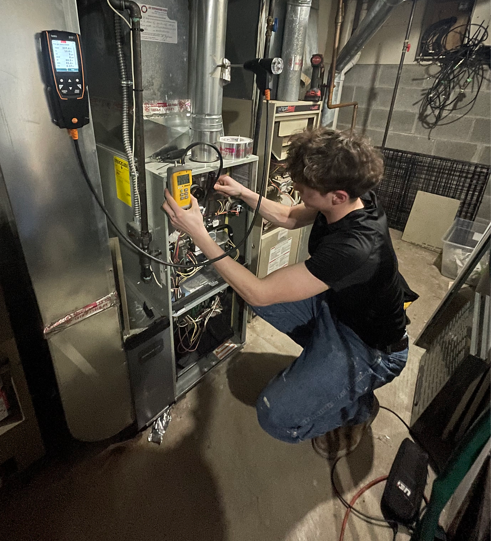 Technician performing furnace tune up