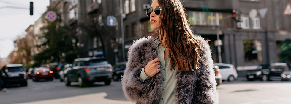 photo-cheerful-caucasian-woman-with-beautiful-smile-spectacular-woman-fur-c-oat-posing-wit