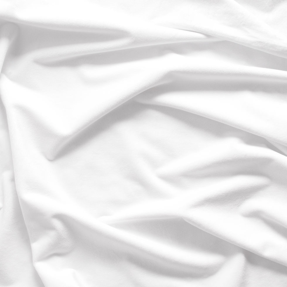 White Silky Minky by EZ Fabric showing its smooth plush surface, 3 mm pile and 90-inch nominal width.