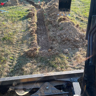 trench digging excavating for buried downspout noblesville
