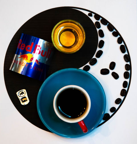 Photograph of yin and yang symbol created with Red Bull and coffee