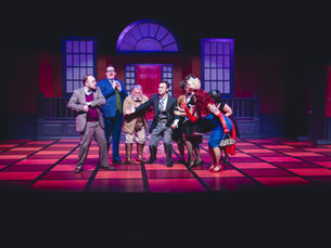 Cast of Clue on stage at Yates Memorial Theatre in Lethbridge
