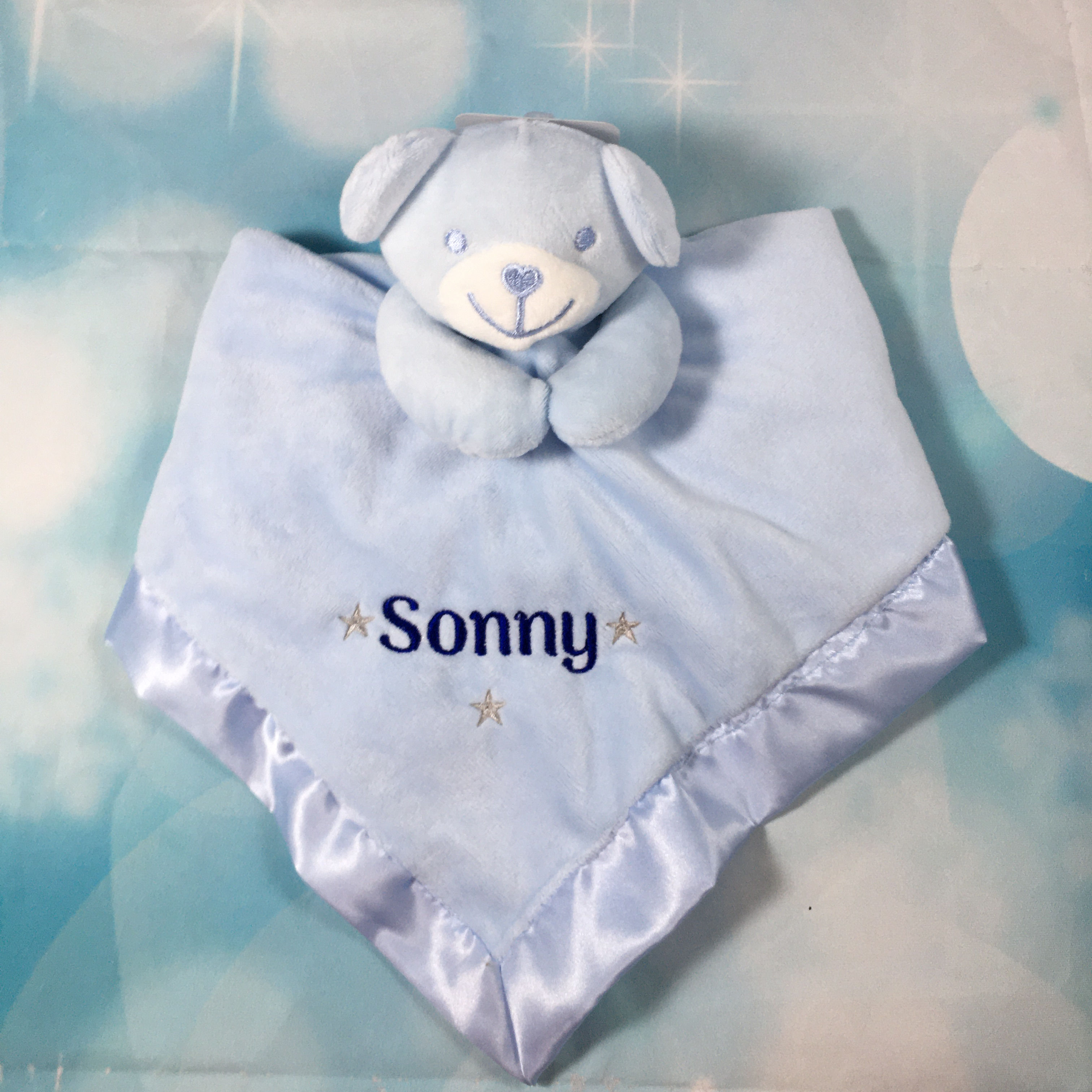 personalised comforter with satin rim.