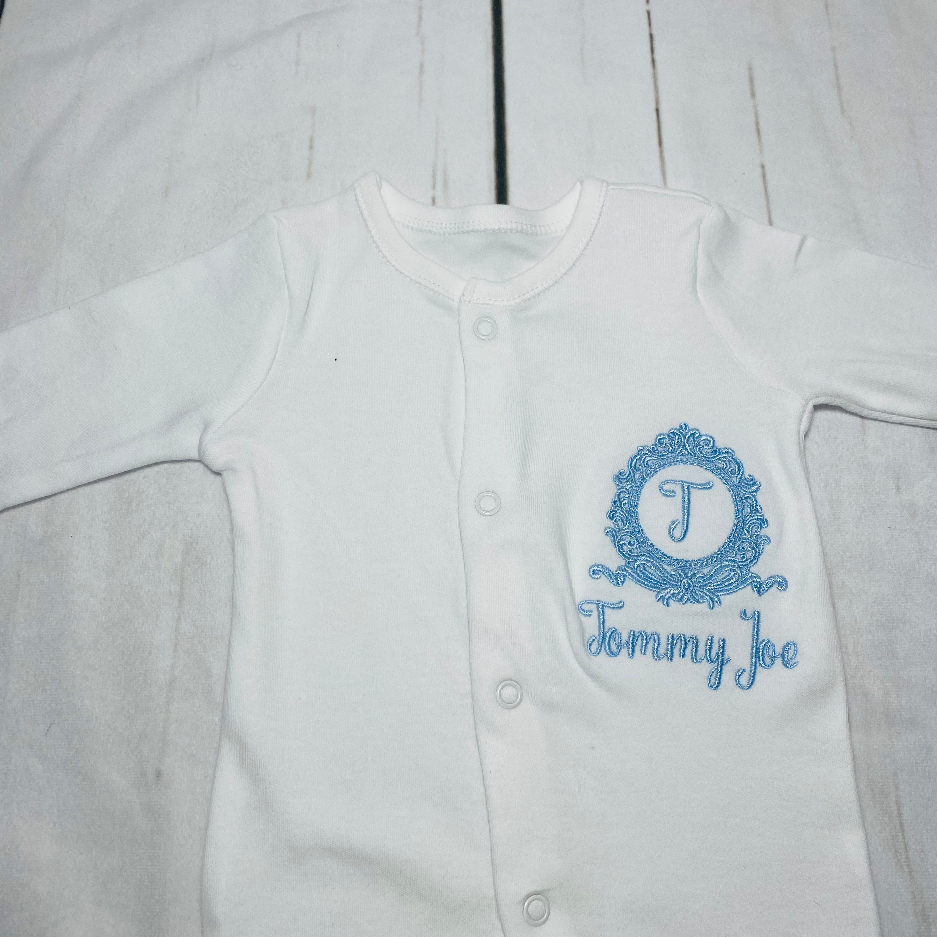 Bow crest baby grow