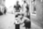 a boy looking into the photo during his photoshoot in Weesp