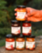 Five jars of Chatakchara brand pickles with Indian-inspired labels