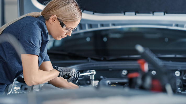 woman-working-car-engine-with-wrench-it.jpg