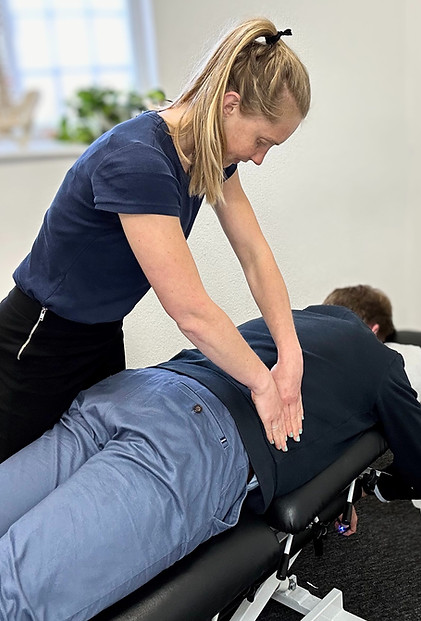 Chiropractor performing an adjustment on a patient at Marlborough Chiropractic