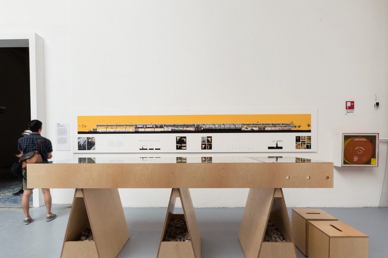 Man looking at drawings and models of Anhembi Tennis Club exhibition by Donaghy + Dimond at the Venice Biennale 2018