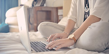 Laptop Typing on Bed