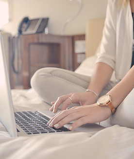 Laptop Typing on Bed