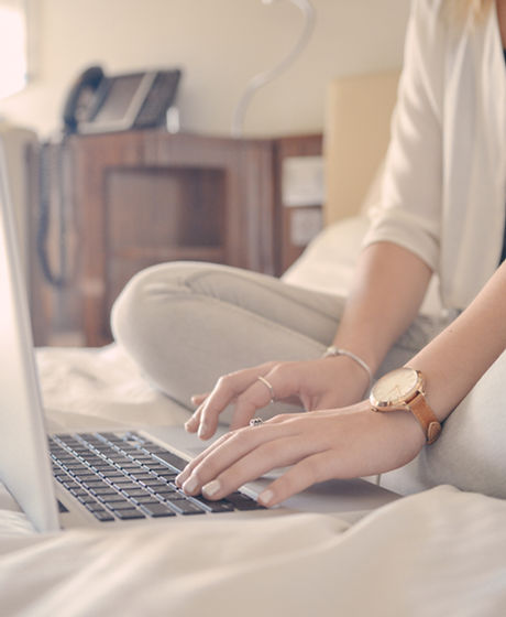 Laptop Typing on Bed