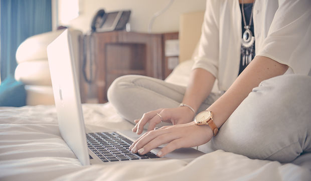 Laptop Typing on Bed
