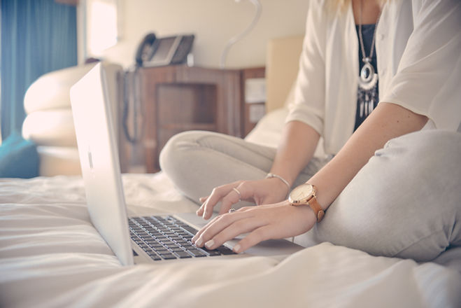 Laptop Typing on Bed