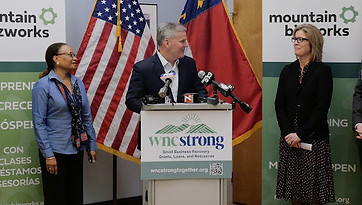 Esther with Gov Stein honoring Mtn Bizworks.jpg