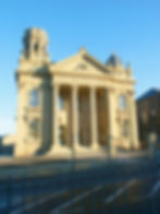 A historic building restored with intricate detailing and a classic stone façade.