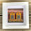 Thumbnail: Handcrafted Framed Picture featuring two gold / ochre quaint seaside huts.